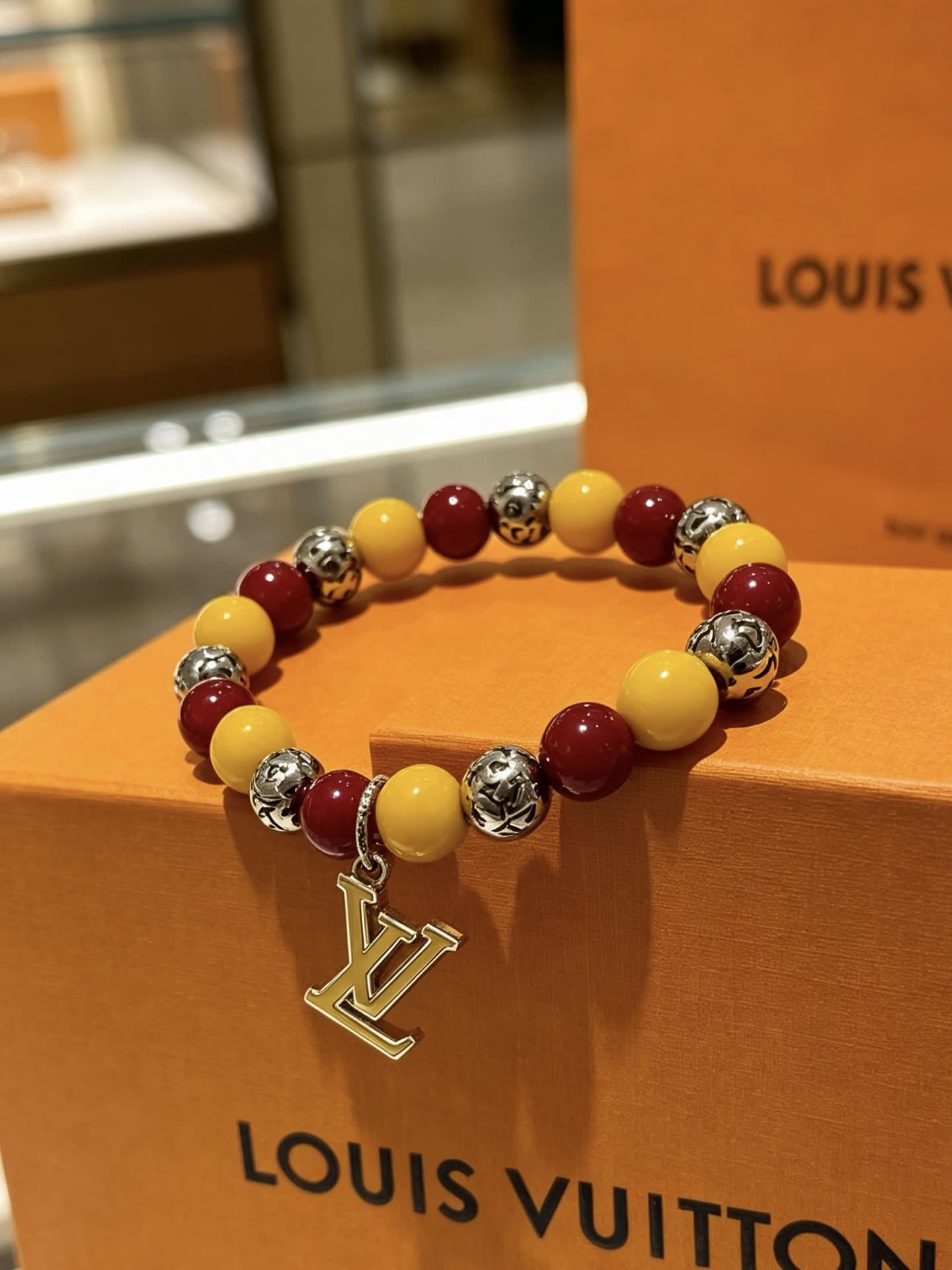 Louis Vuitton Beaded Bracelet with Monogram Charm